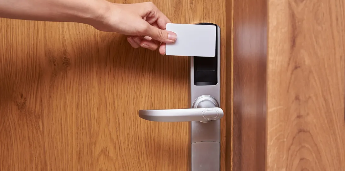 Hand open digital door lock with key card. Security alarm concept in hotel room